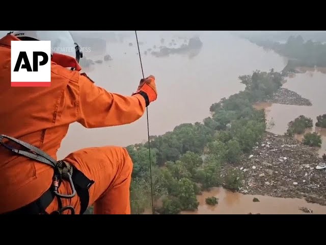 People rescued from rooftops in flood-stricken Brazilian state