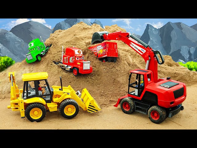 Trucks, cranes rescue Lightning McQueen's container truck from a pile of sand