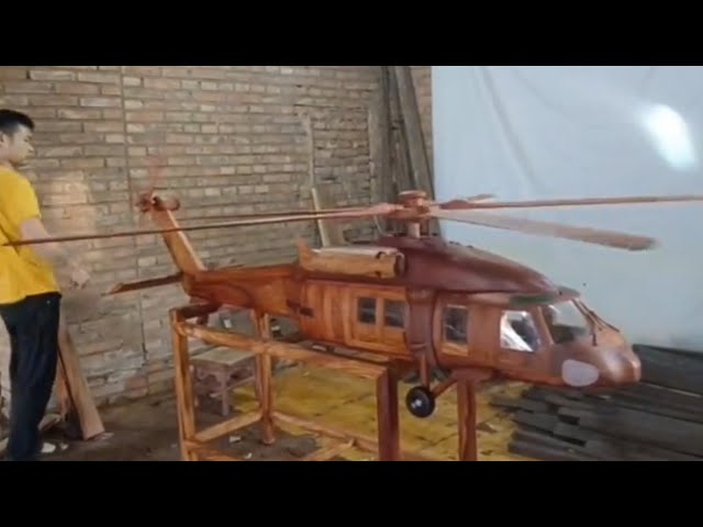 Wooden airplane manufacturing process. Skilled carpenter with excellent skills.
