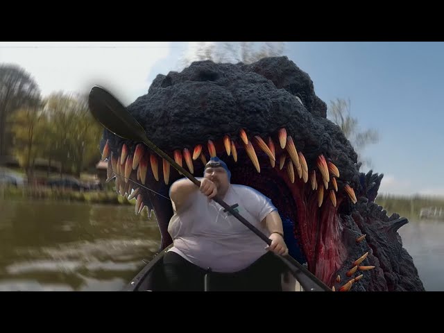Fat guy in canoe sees Godzilla underwater