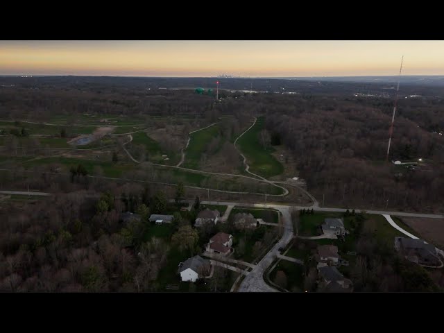 Drone view of eclipse turning landscape dark in suburban Cleveland