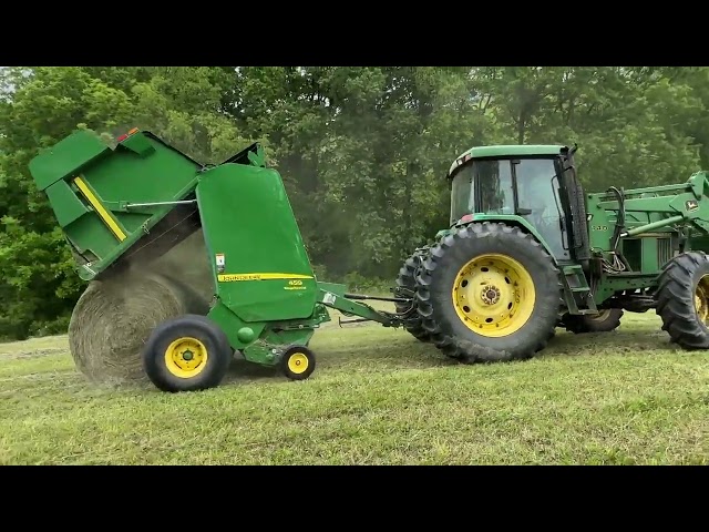 Raking and baling first cutting of hay in 2023