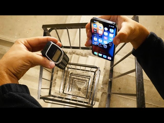 Dropping an iPhone 13 Pro vs Nokia 3310 Down Spiral Staircase 20 Stories - Will it Survive?