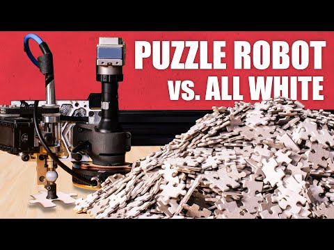 Worlds hardest jigsaw vs. puzzle machine (all white)