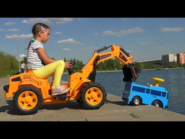Sofia on toy Excavator Helps the  Little Bus on Сhildren's park