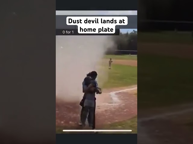 Dust devil lands at home plate