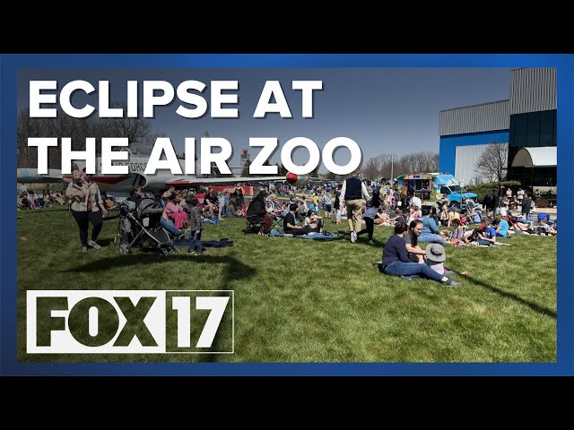 Solar eclipse draws hundreds to Air Zoo lawn