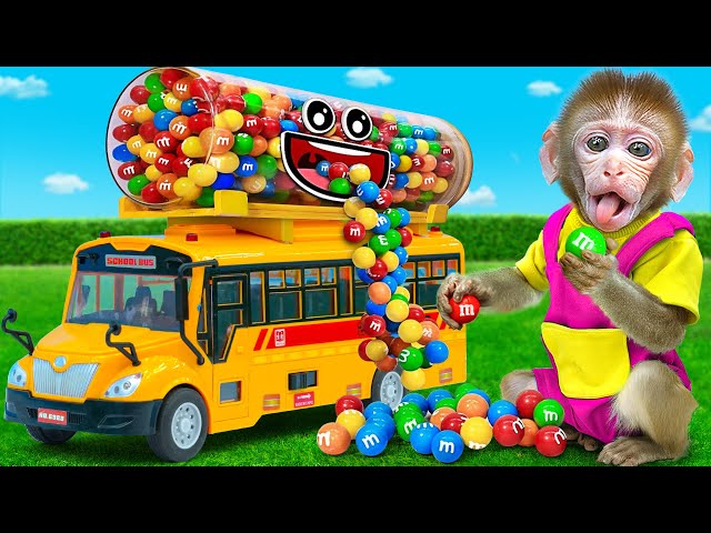 Kiki Monkey gets trouble when playing with Colorful M&M Candy School Bus   | KUDO ANIMAL KIKI