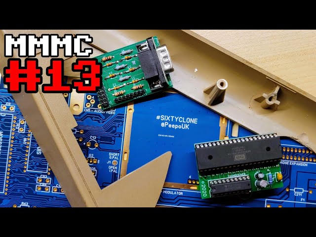 A smashed C64, a C128 to SCART adapter, a W65C02S to 6502 adapter and a replica C64