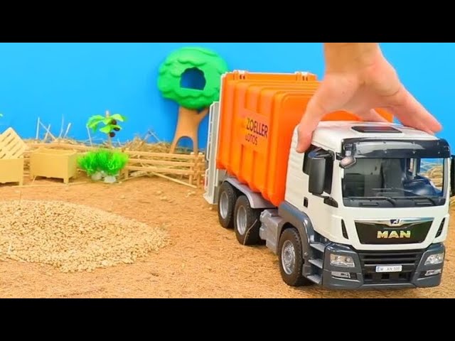 Müllwagen, Containerauto, MAN Lastwagen, Mähdrescher und Traktoren auf dem Spielzeug Bauernhof