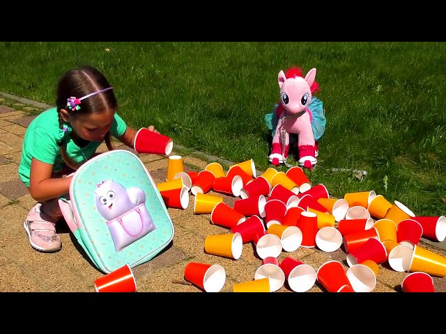 Sofia Plays With Colored Cups and Ride On Сhildren's Сar