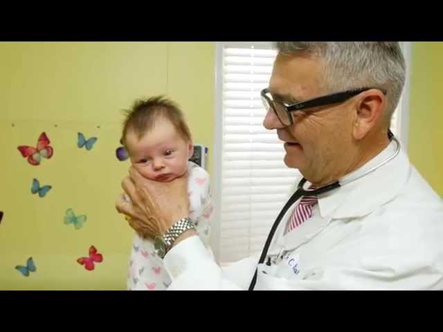 How To Calm A Crying Baby - Dr. Robert Hamilton Demonstrates "The Hold" (Official)