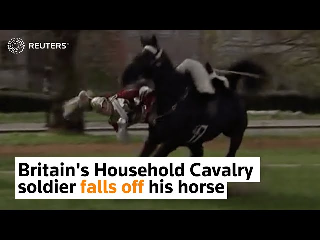 Britain's Household Cavalry soldier falls off his horse