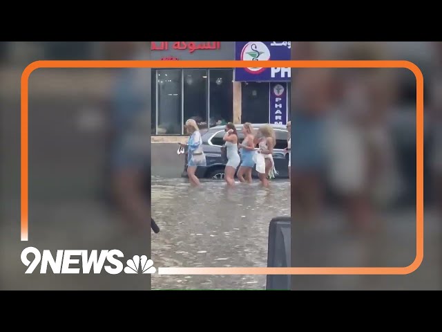 UAE: People wade through floodwaters in Dubai