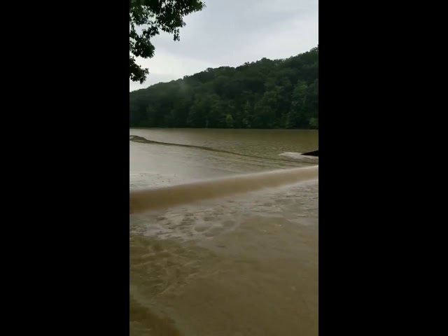 Car partially submerged by flooding in Brown County