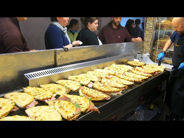 Italy Street Food. Flat Bread Filled with Salami, Ham, Mortadella. 'Spianata Bolognese'