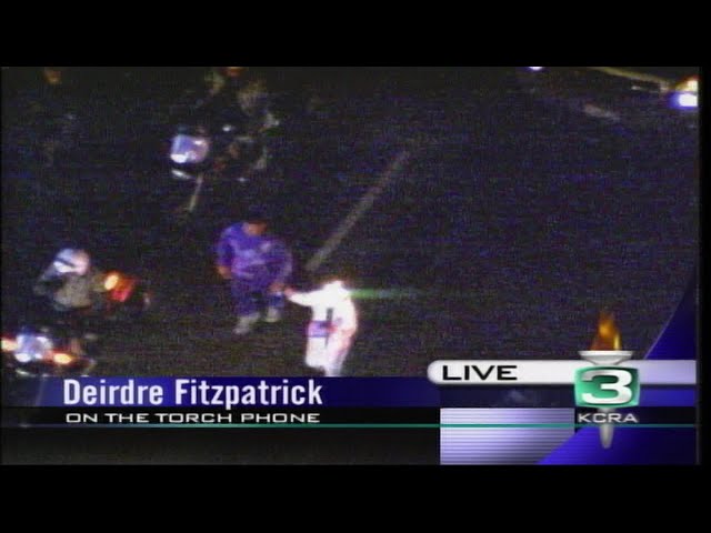 KCRA 3's Deirdre Fitzpatrick reports while running in the 2002 Olympic torch relay in Sacramento