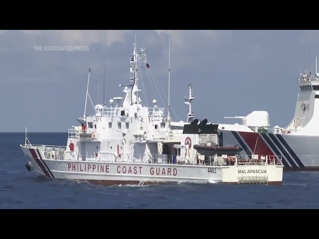 Chinese ship blocks Philippine vessel as journalists watch