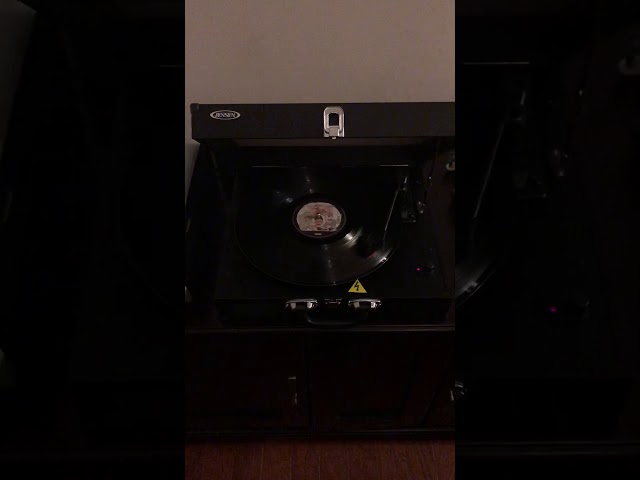 Listening to Queen on a record player