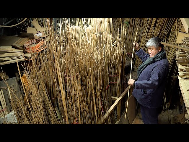 The process of making a fishing rod from solid bamboo. Korean traditional fishing rod craftsman
