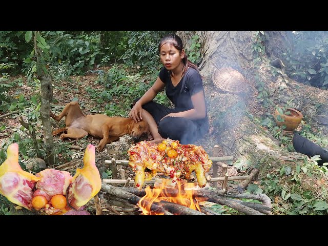 Survival cooking in forest: Grilled chicken thighs and egg Spices delicious Eating with dog