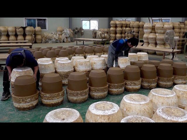 process of making a jar for storing salt. Huge scale Korean ceramics mass production factory