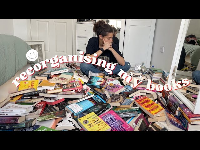 reorganising my bookcase (except its just a big pile of books)