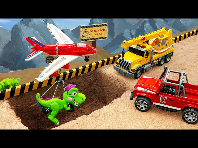 Rescue cars, cranes rescue cars and dinosaur planes from sand pits